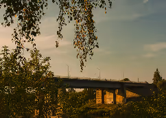 Bridge over a river at sunset.