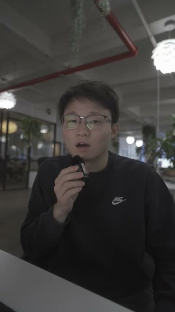 To camera, desk